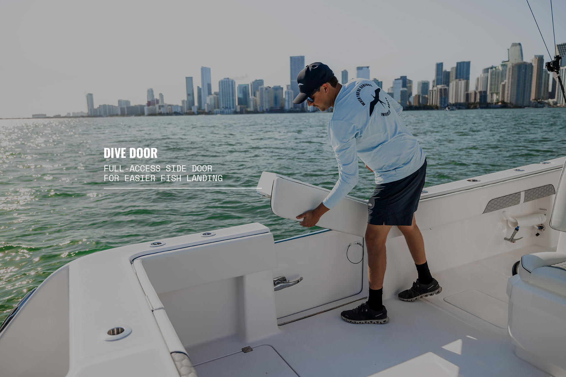 Man opening the dive door on a 36 Catamaran