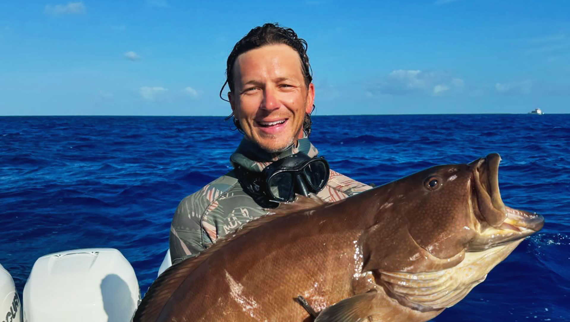 Captain Tony Young Holding a Large Fish